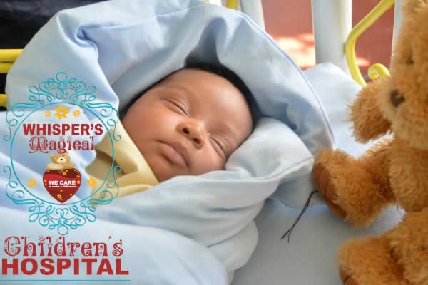 Sleeping infant in hospital bed